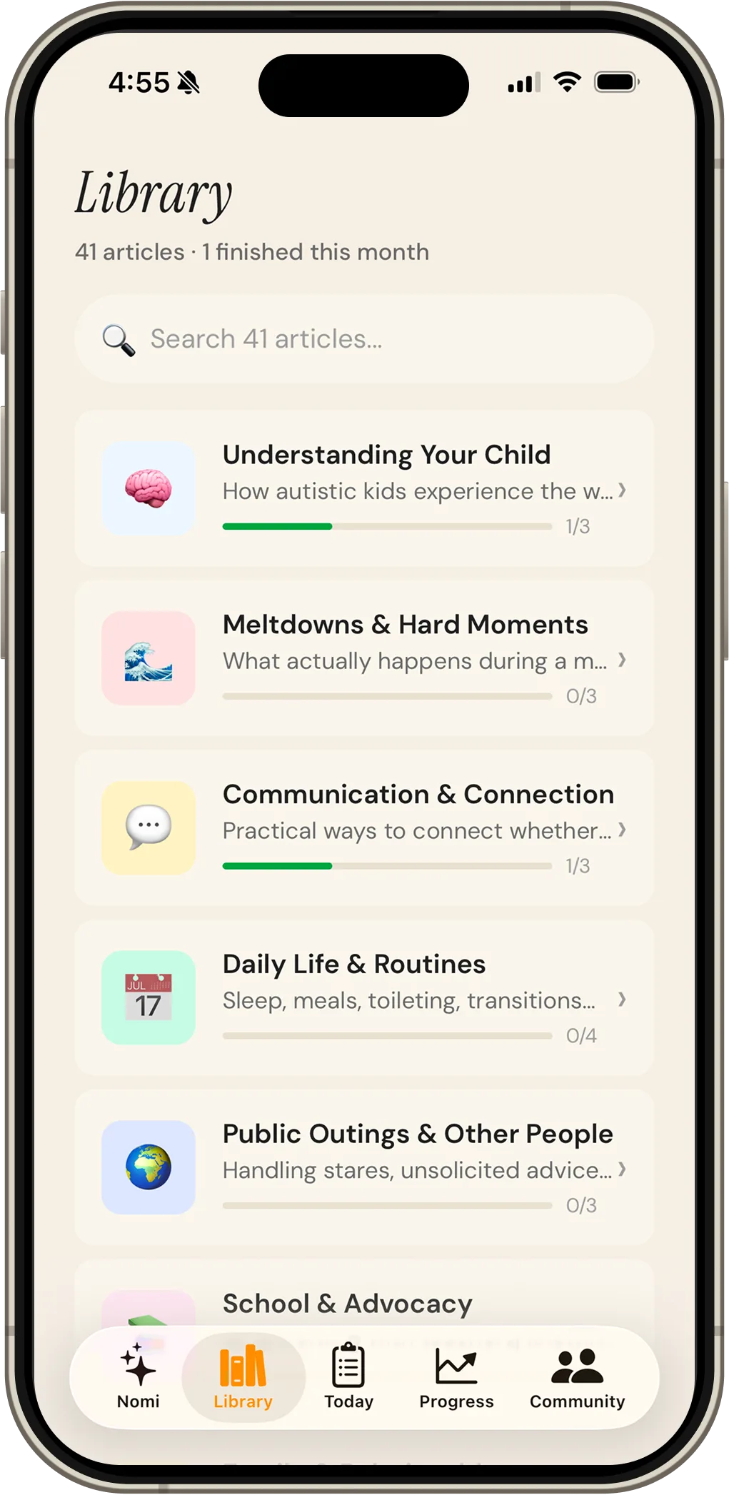 The Nomi Library screen listing article collections including Understanding Your Child, Meltdowns and Hard Moments, and Communication and Connection.